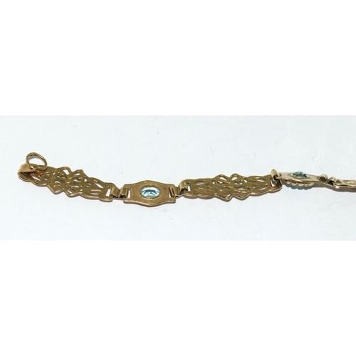 59 - A 9ct Gold Ladies Fancy Link Aquamarine Bracelet. Weight - 6g