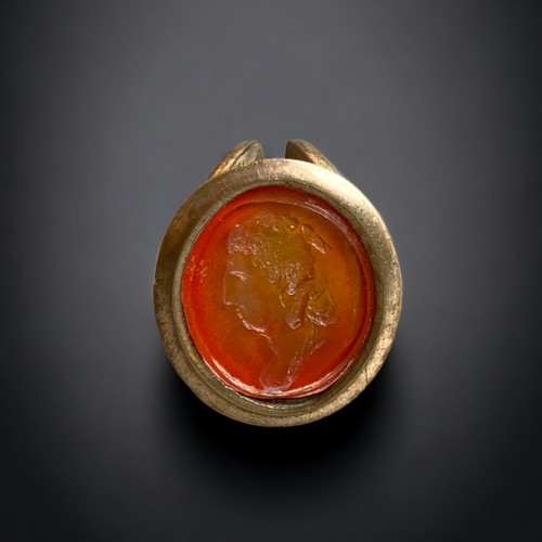 98 - A LARGE 19TH CENTURY GILT METAL WAX INTAGLIO SEAL, TOGETHER WITH TWO OTHER FOBS.