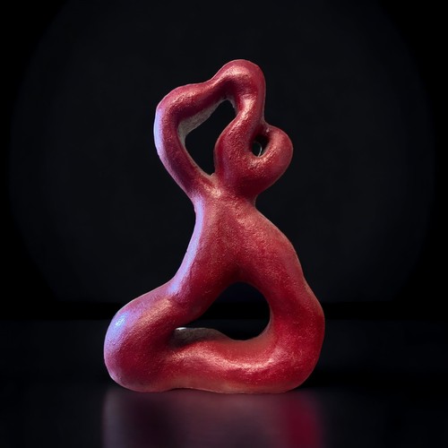 34 - A RED ABSTRACT SCULPTURE.
20