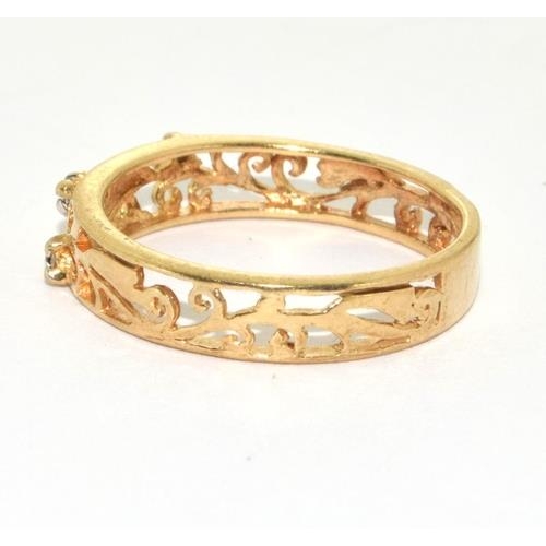 119 - 9ct gold ladies open work ring set with Diamonds size M