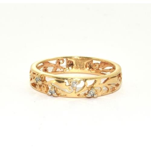 119 - 9ct gold ladies open work ring set with Diamonds size M