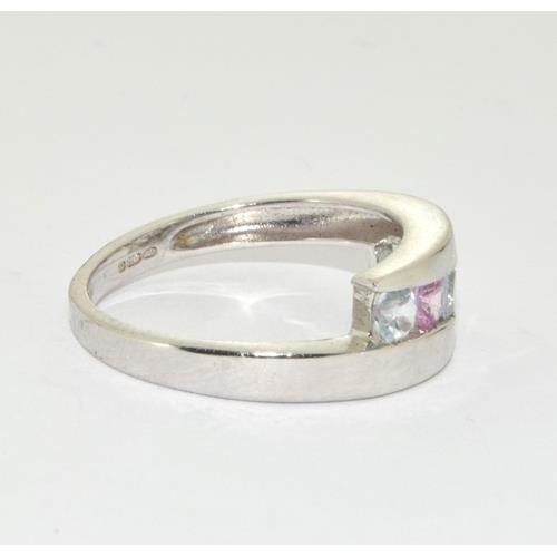 233 - 9ct white gold ladies Pink Tourmaline and Aquamarine set ring in a wave pattern size L