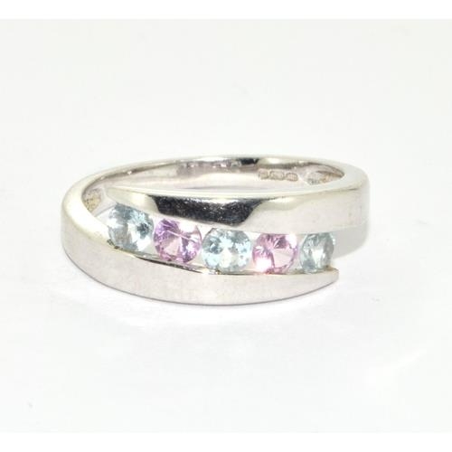 233 - 9ct white gold ladies Pink Tourmaline and Aquamarine set ring in a wave pattern size L