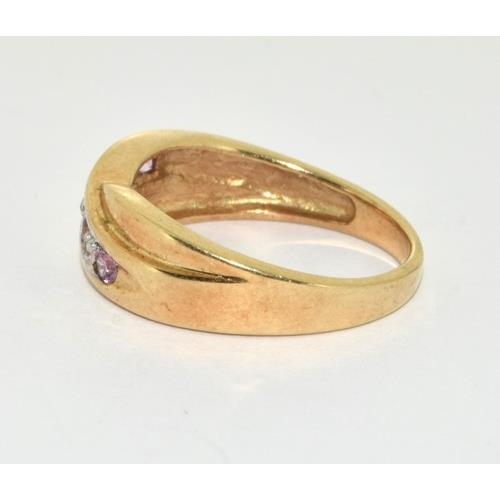 117 - 9ct gold ladies diamond and Pink Tourmaline cross over ring size M