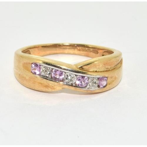 117 - 9ct gold ladies diamond and Pink Tourmaline cross over ring size M