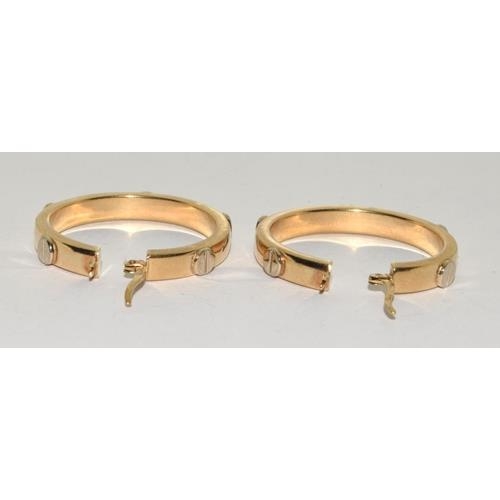 178 - 9ct gold ladies round hoop earrings in the Cartier love style 30mm