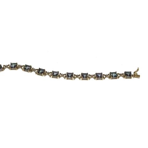 112 - 9ct gold ladies Mystic Topaz line bracelet 21cm long 9.5g