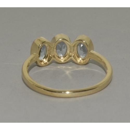 160 - A 9ct gold aquamarine three stone ring Size P