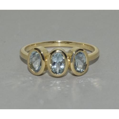 160 - A 9ct gold aquamarine three stone ring Size P