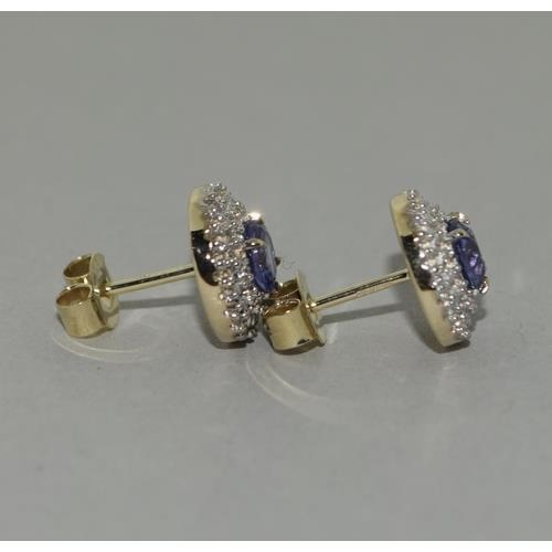 136 - A pair of  9ct gold Tanzanite and Zircon earrings.