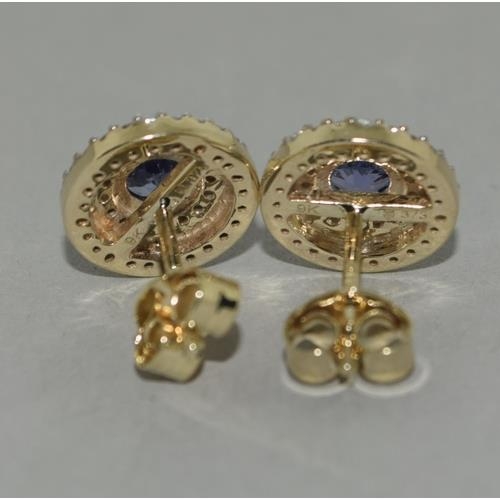 136 - A pair of  9ct gold Tanzanite and Zircon earrings.