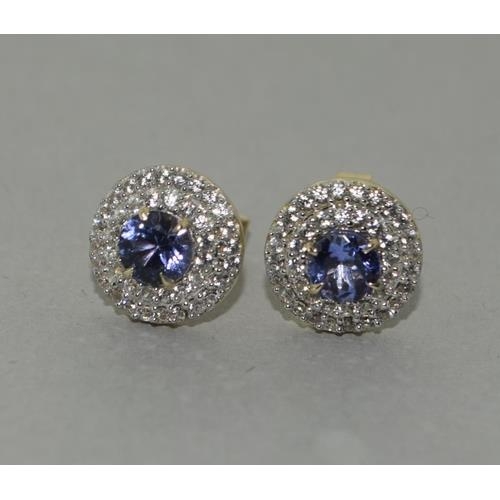 136 - A pair of  9ct gold Tanzanite and Zircon earrings.