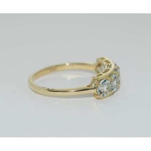 96 - A 9ct gold aquamarine 5 stone ring Size N