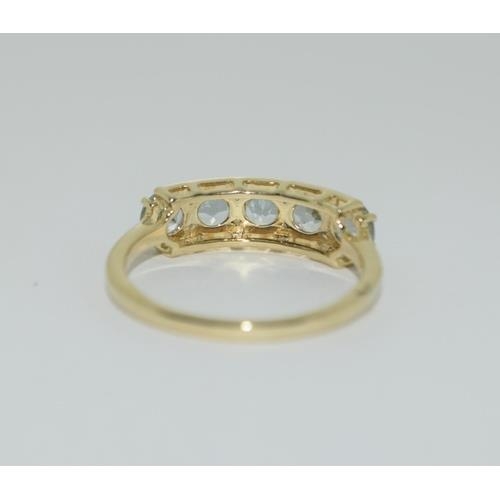 96 - A 9ct gold aquamarine 5 stone ring Size N