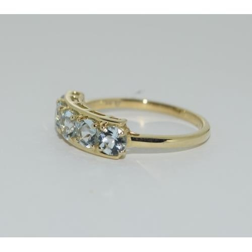 96 - A 9ct gold aquamarine 5 stone ring Size N