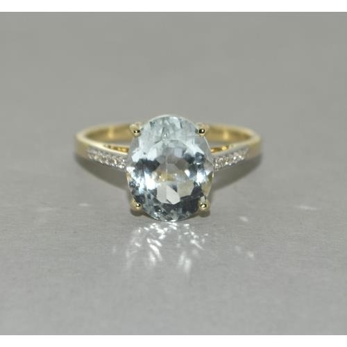 78 - A 9ct gold aquamarine and zircon ring, Size P