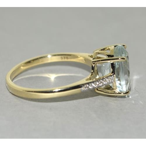 78 - A 9ct gold aquamarine and zircon ring, Size P