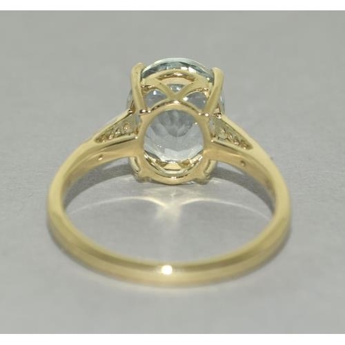 78 - A 9ct gold aquamarine and zircon ring, Size P