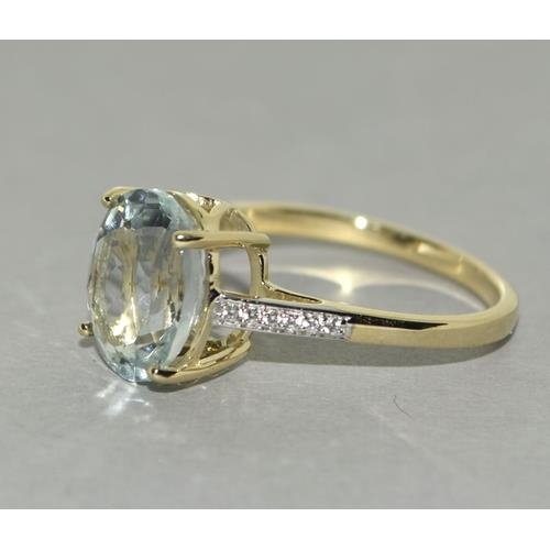 78 - A 9ct gold aquamarine and zircon ring, Size P