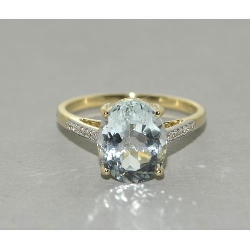 78 - A 9ct gold aquamarine and zircon ring, Size P