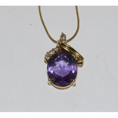 216 - 18ct Gold Amethyst Diamond pendant on 9ct Gold chain.