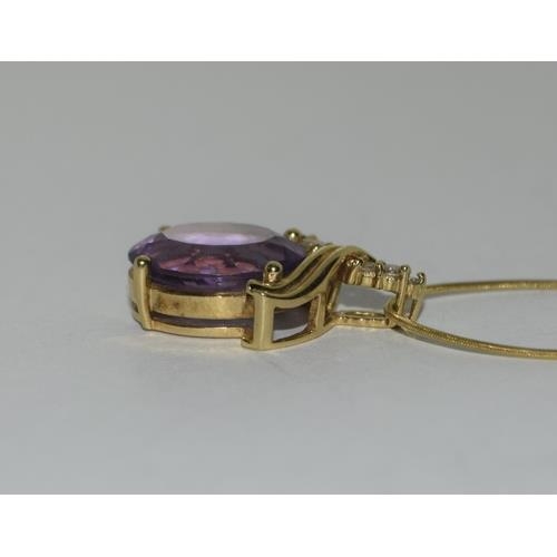 216 - 18ct Gold Amethyst Diamond pendant on 9ct Gold chain.