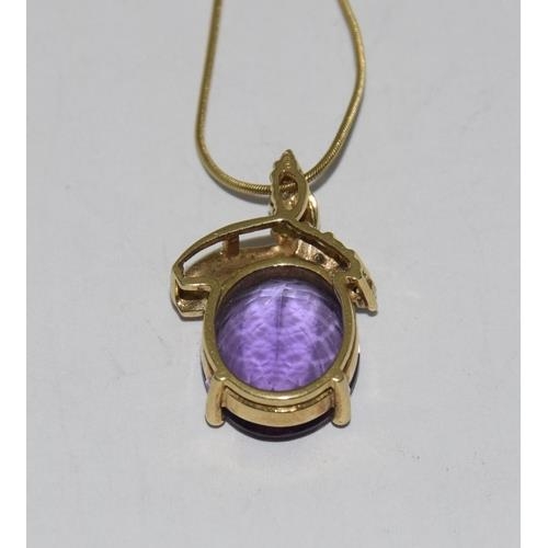 216 - 18ct Gold Amethyst Diamond pendant on 9ct Gold chain.