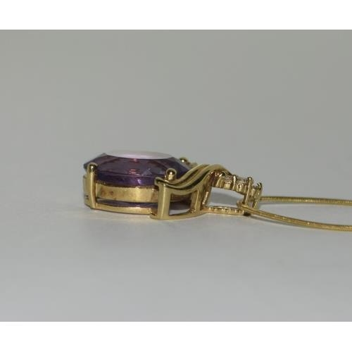 216 - 18ct Gold Amethyst Diamond pendant on 9ct Gold chain.