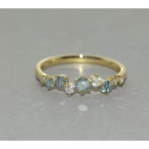 293 - A 9ct gold blue and white diamond ring. Size P