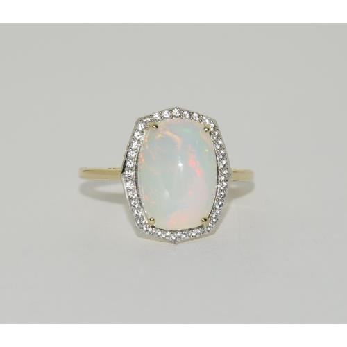 193 - 9ct Gold Opal white sapphire ring. Size T 1/2.