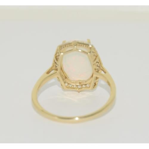 193 - 9ct Gold Opal white sapphire ring. Size T 1/2.