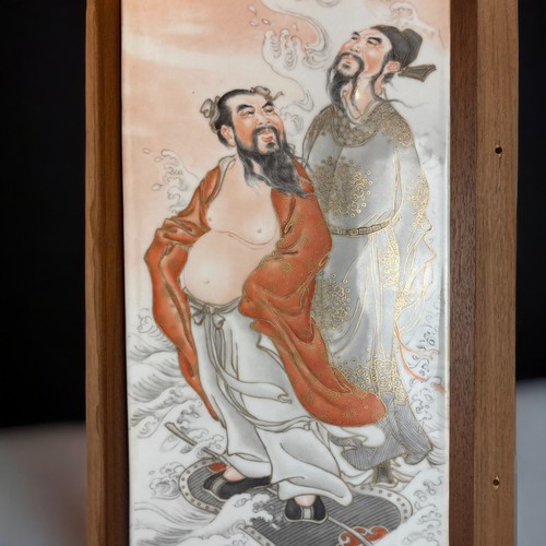 292 - A LARGE CHINESE PORCELAIN HAND PAINTED WALL PLAQUE.
DEPICTING TWO DAOIST IMMORTALS.
MOUNTED ON WOODE... 