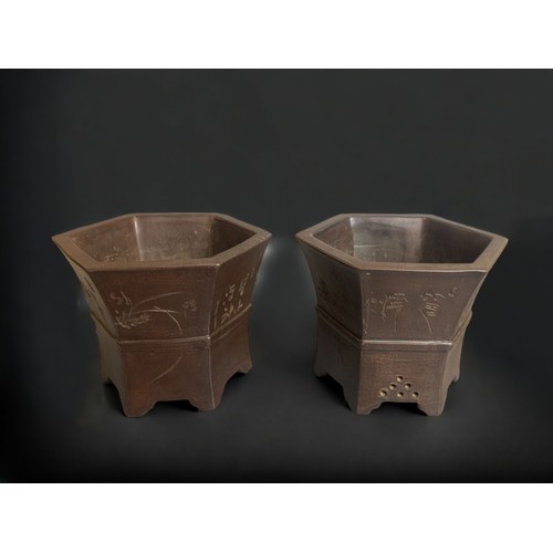 304 - A PAIR OF CHINESE YIXING ZISHA BONSAI PLANTERS.
HEXAGONAL FORM, WITH REPEATING PANELS OF BAMBOO & OR... 