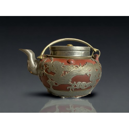 305 - A CHINESE PEWTER OVERLAY YIXING TEAPOT. 
EARLY 20TH CENTURY.
DEPICTING DRAGONS CHASING THE PEARLY AM... 