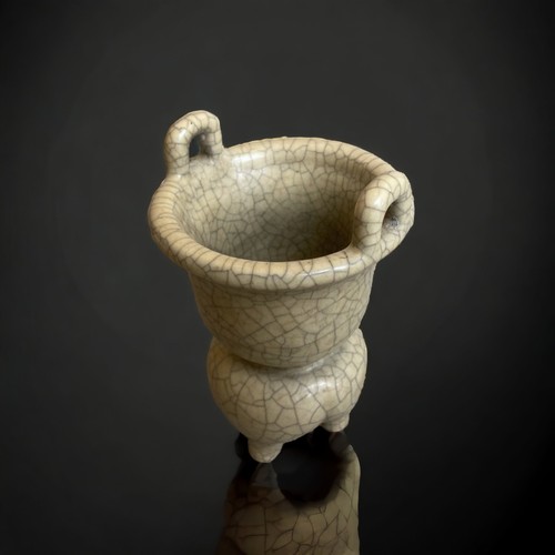 306 - A CHINESE GUAN TYPE TRIPOD CENSER.
GOURD SHAPE WITH LOBED TRIPOD FORM BASE AND TWIN HANDLES TO BOWL.... 