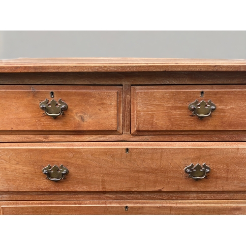 27 - A LATE VICTORIAN WAXED PINE FOUR DRAWER CHEST OF DRAWERS.