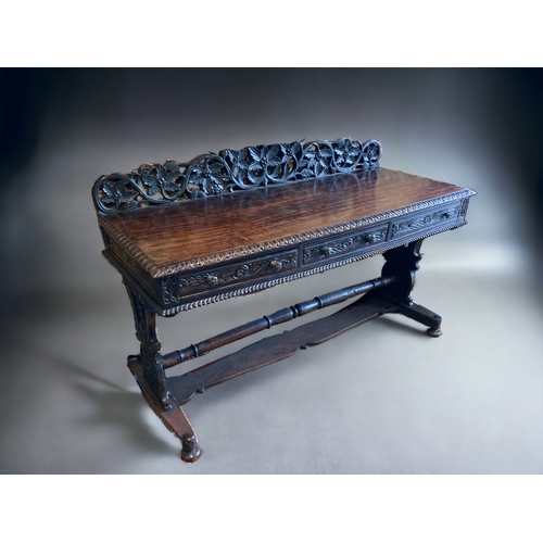 39 - A MID VICTORIAN ANGLO-INDIAN PADOUK WOOD SIDEBOARD. ELABORATELY HAND-CARVED FOLIATE DESIGN.