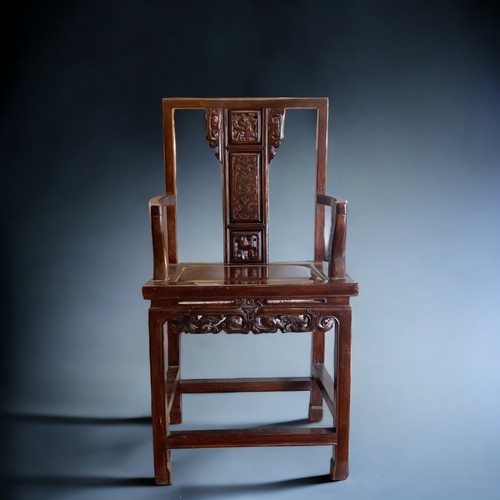 40 - A CHINESE CARVED HARDWOOD ARMCHAIR, 20TH CENTURY. The splat carved with a figure and pierced apron. ... 