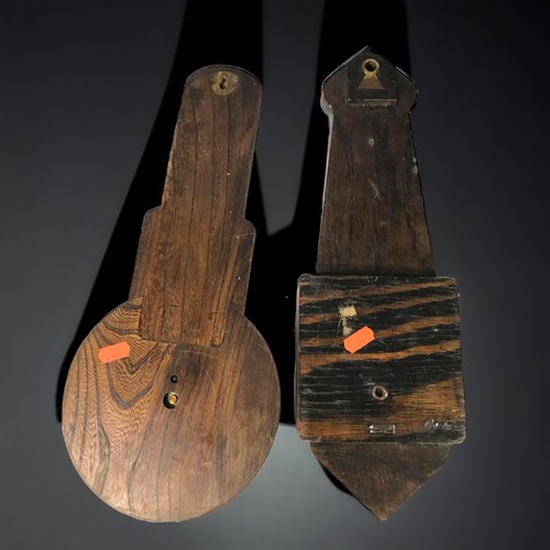 323 - A PAIR OF CARVED OAK BAROMETERS, 20TH CENTURY