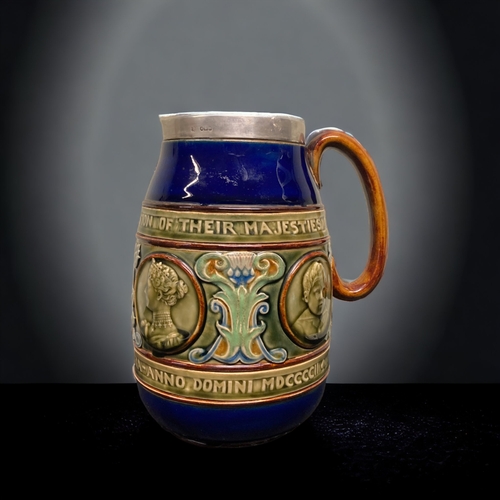 267 - A DOULTON LAMBETH STONEWARE SILVER RIMMED JUG. COMMEMORATING THE CORONATION OF THEIR MAJESTIES KING ... 