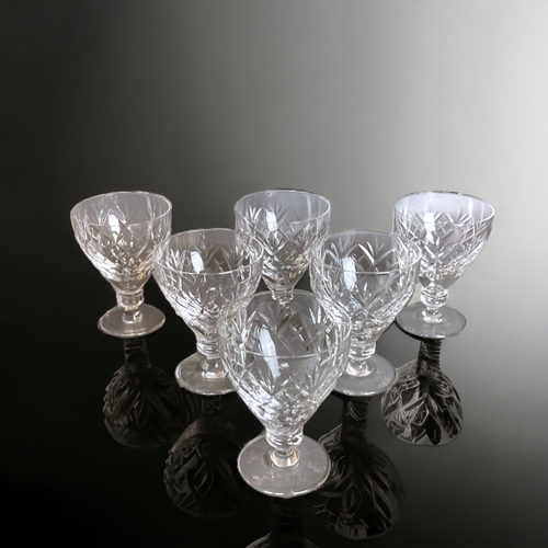 220 - A SET OF SIX WEBB CORBETT 'GEORGIAN' PATTERN WINE GLASSES.