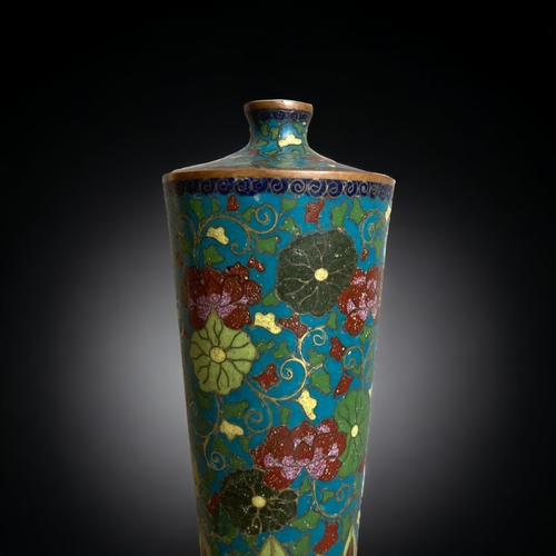 239 - A JAPANESE CLOISONNÉ VASE.
MEIJI PERIOD. 
TAPERED FORM WITH BLOSSOMING FLOWERS. 
16CM TALL