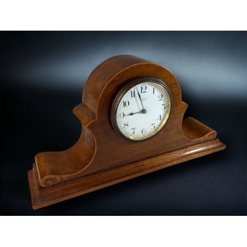 293 - AN EARLY 20TH CENTURY FRUITWOOD INLAID MANTLE CLOCK. 
18 X 33CM