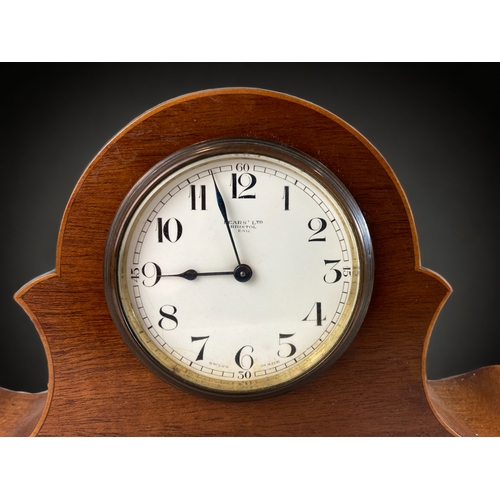 293 - AN EARLY 20TH CENTURY FRUITWOOD INLAID MANTLE CLOCK. 
18 X 33CM