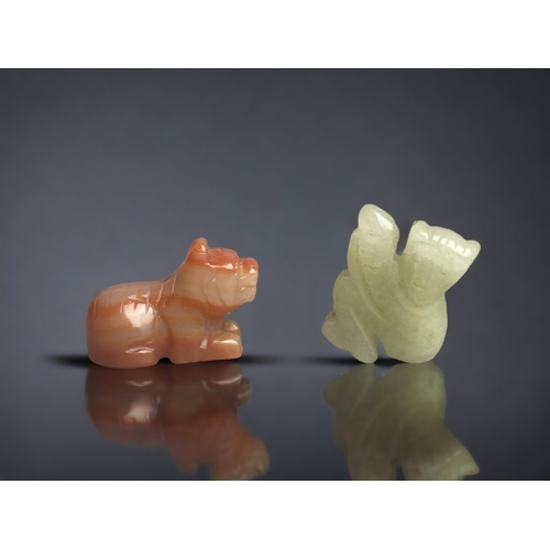 301 - TWO SMALL CHINESE CARVED RUSSET TYPE JADE PIXIU AND MONKEY.
MONKEY - 22 X 20 MM