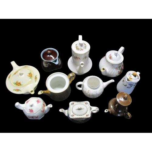 203 - A collection of Decorative China Tea and Coffee pots including Denby, Madock and Royal Doulton