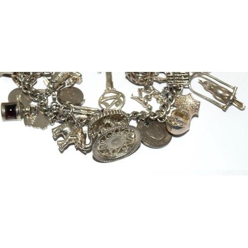 203 - Large silver charm bracelet and charms approx 20, 100g