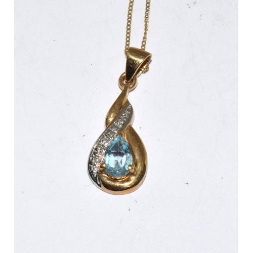 134 - 9ct gold diamond and Topaz earrings and matching pendant necklace