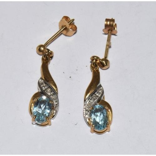 134 - 9ct gold diamond and Topaz earrings and matching pendant necklace