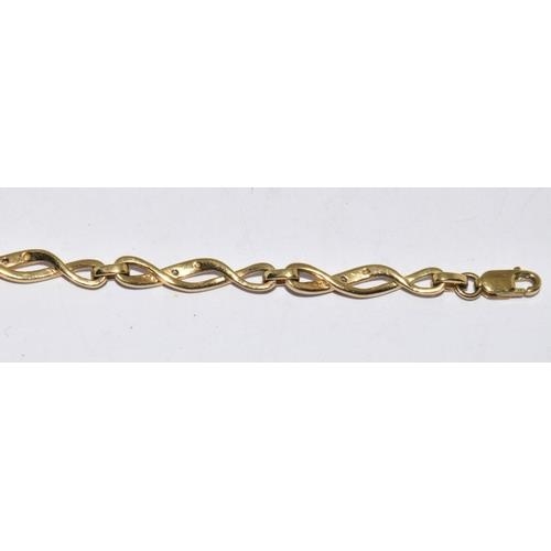 237 - 9ct gold and diamond Celtic style lobster claw bracelet with diamond insert. 7 inches long